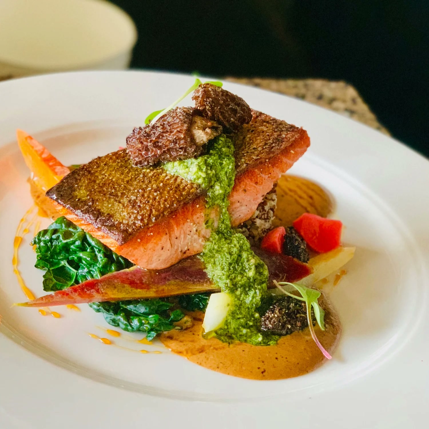 Pan-seared king salmon with crispy skin and basil pesto at Wild Sage Bistro, Spokane